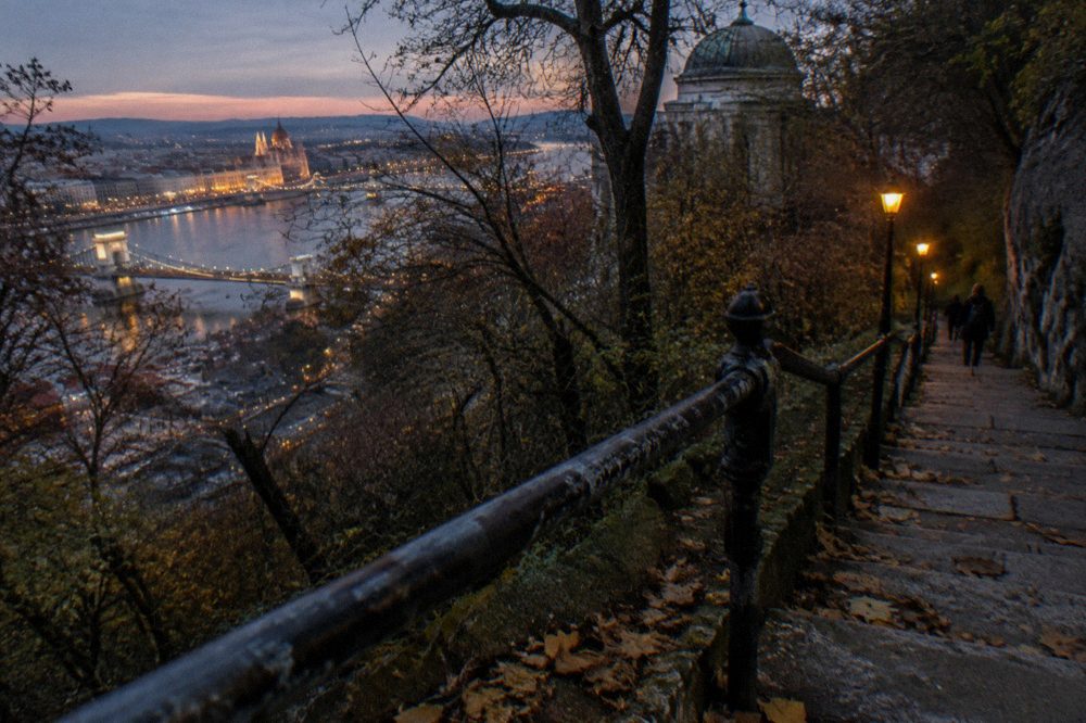Stone stairway climbing toward Buda Castle walls in the evening