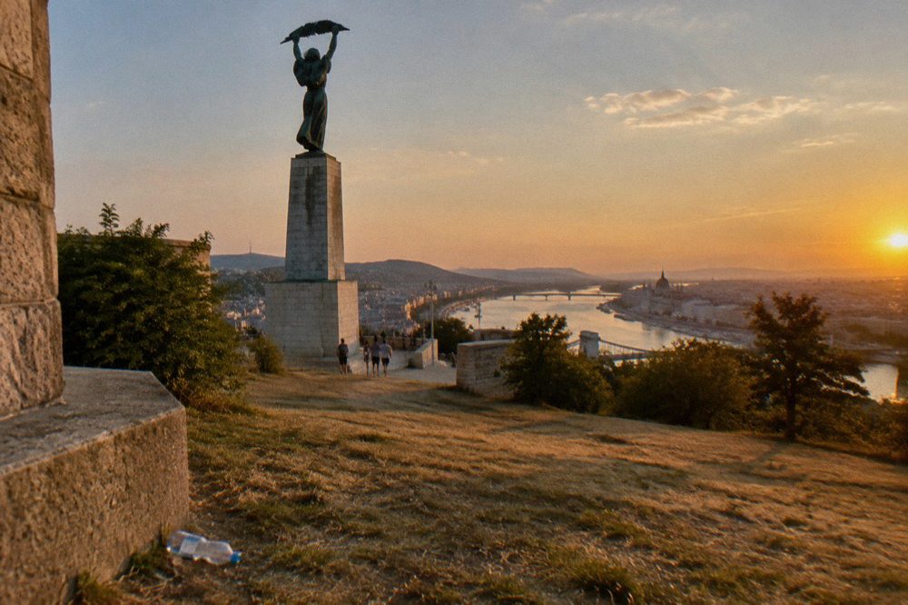 The Liberty Statue and Citadella park above Budapest at golden hour