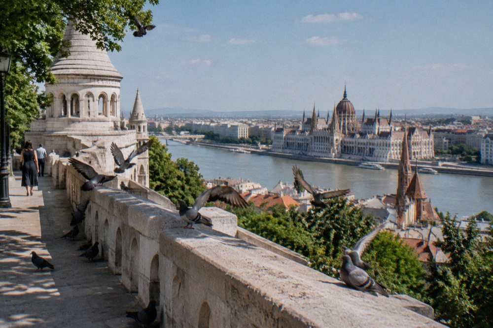 The ramparts of Castle Hill above the Danube, with the Parliament building visible across the river in Pest