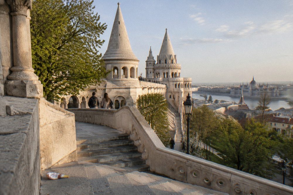 The white towers and stairways of Fisherman's Bastion seen from a Castle Hill terrace