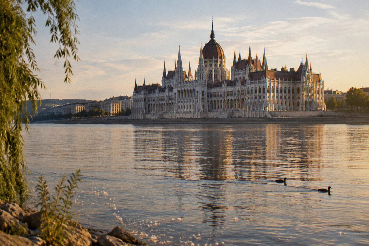 The Danube riverside in Budapest with the Parliament building across the water in daylight