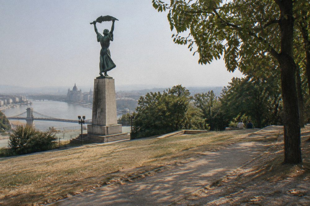The Liberty Statue standing above the Citadella park on Gellért Hill