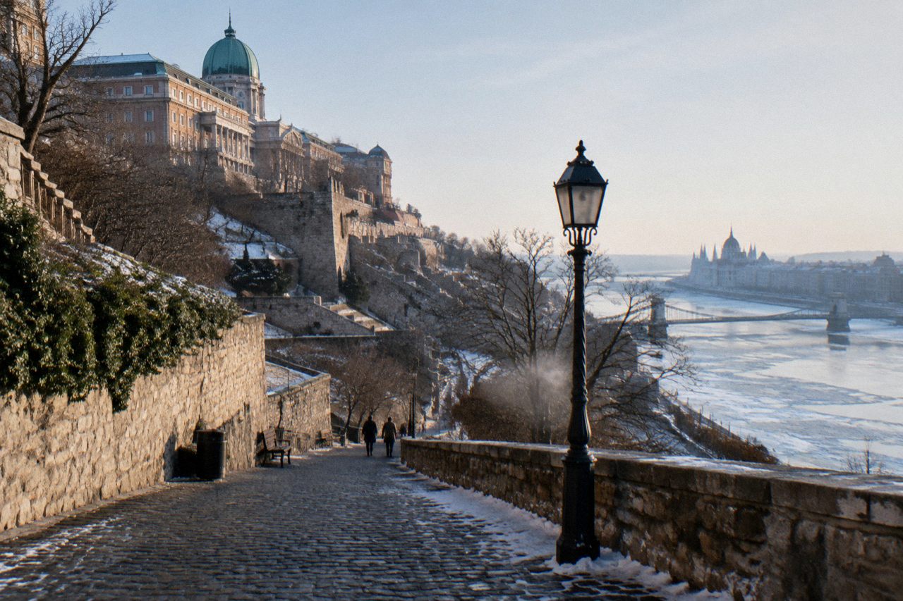 The stone ramparts and towers of Buda Castle Hill rising above the Danube in Budapest