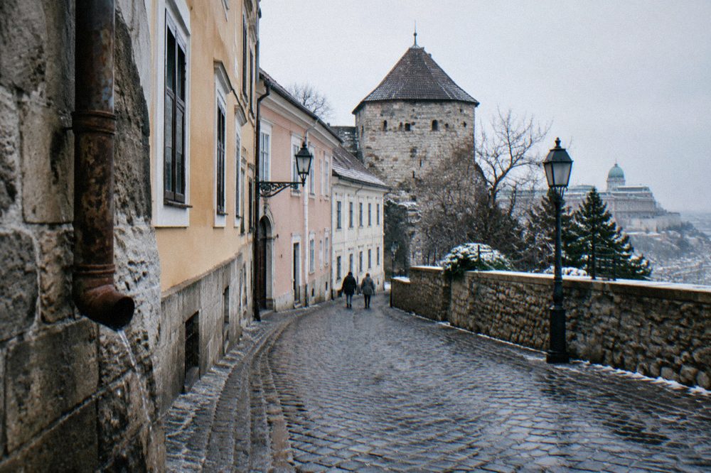 Medieval streets and towers of Buda Castle Hill under a pale winter sky