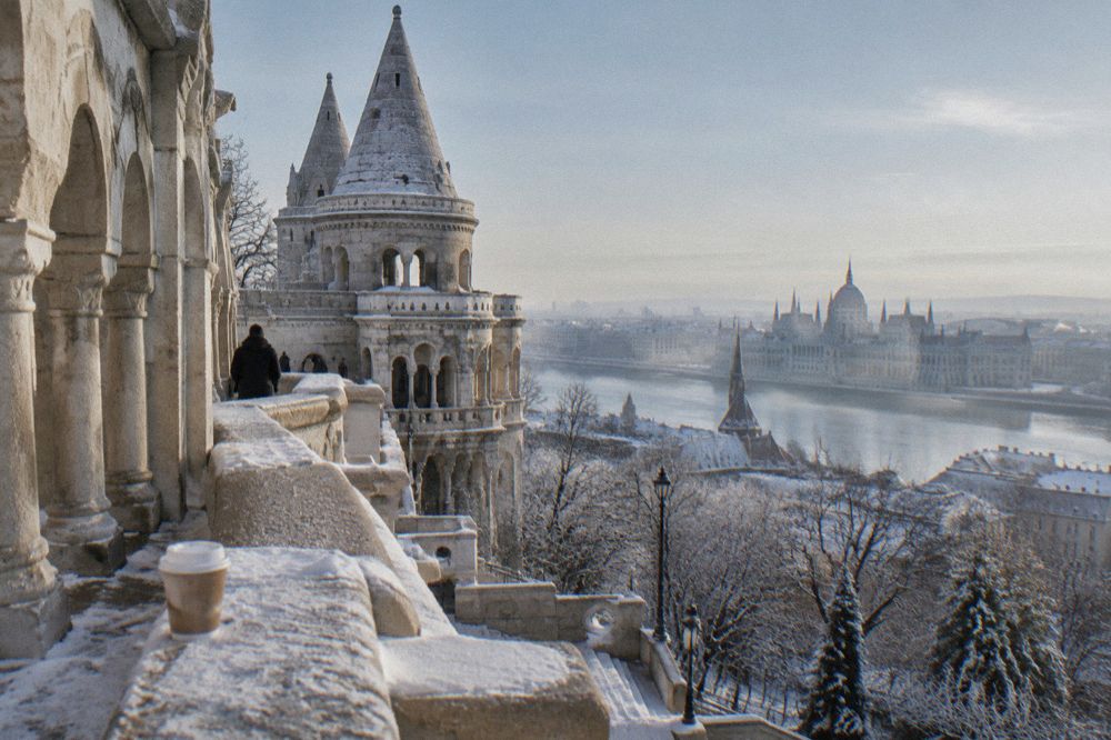 The white towers and terraces of Fisherman's Bastion with snow on the balustrades