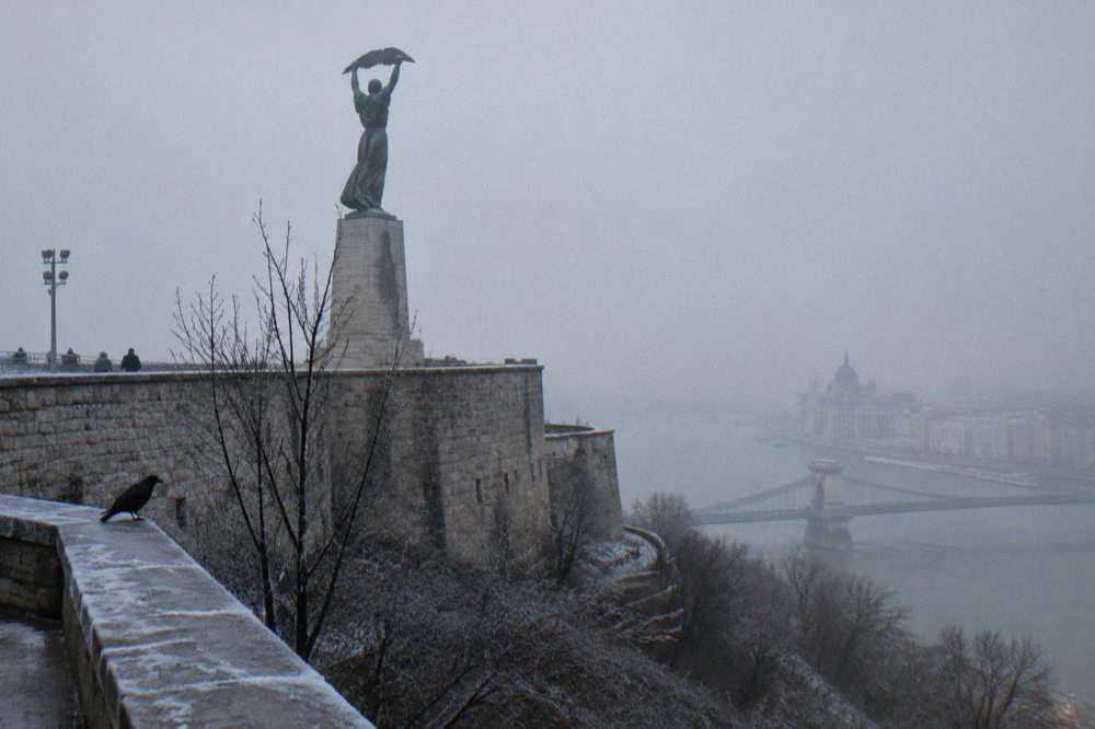 The Liberty Statue above the fortress walls of the Citadella on Gellért Hill