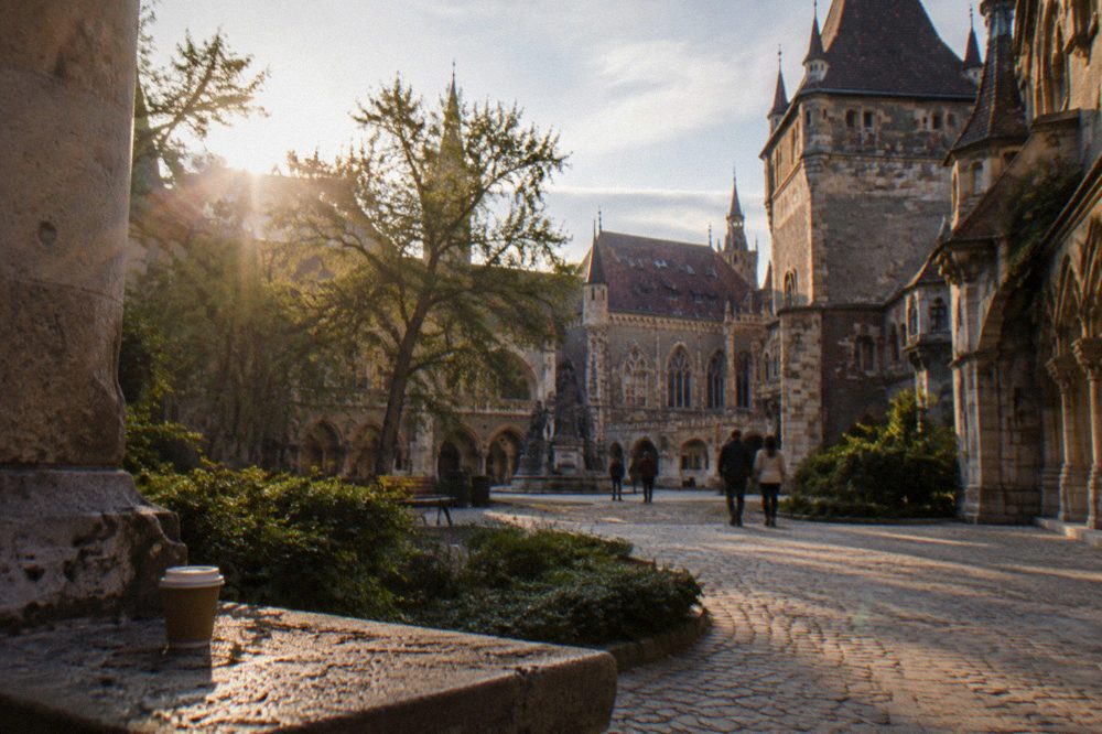Vajdahunyad courtyard in Budapest with ornate towers and arches around an open walkable court