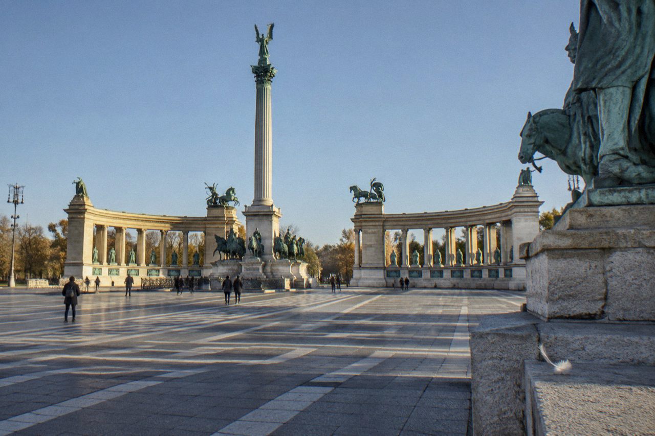 Heroes' Square in Budapest with its monument column and colonnade statues under an open sky