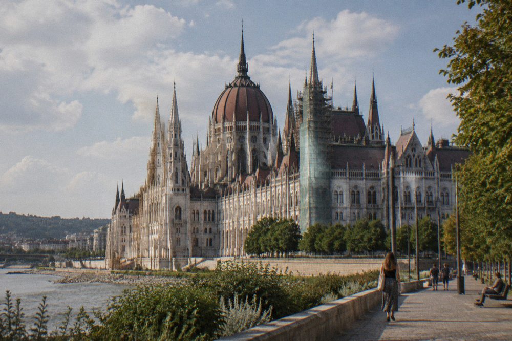 The dome and gothic spires of the Hungarian Parliament seen from the Danube riverfront