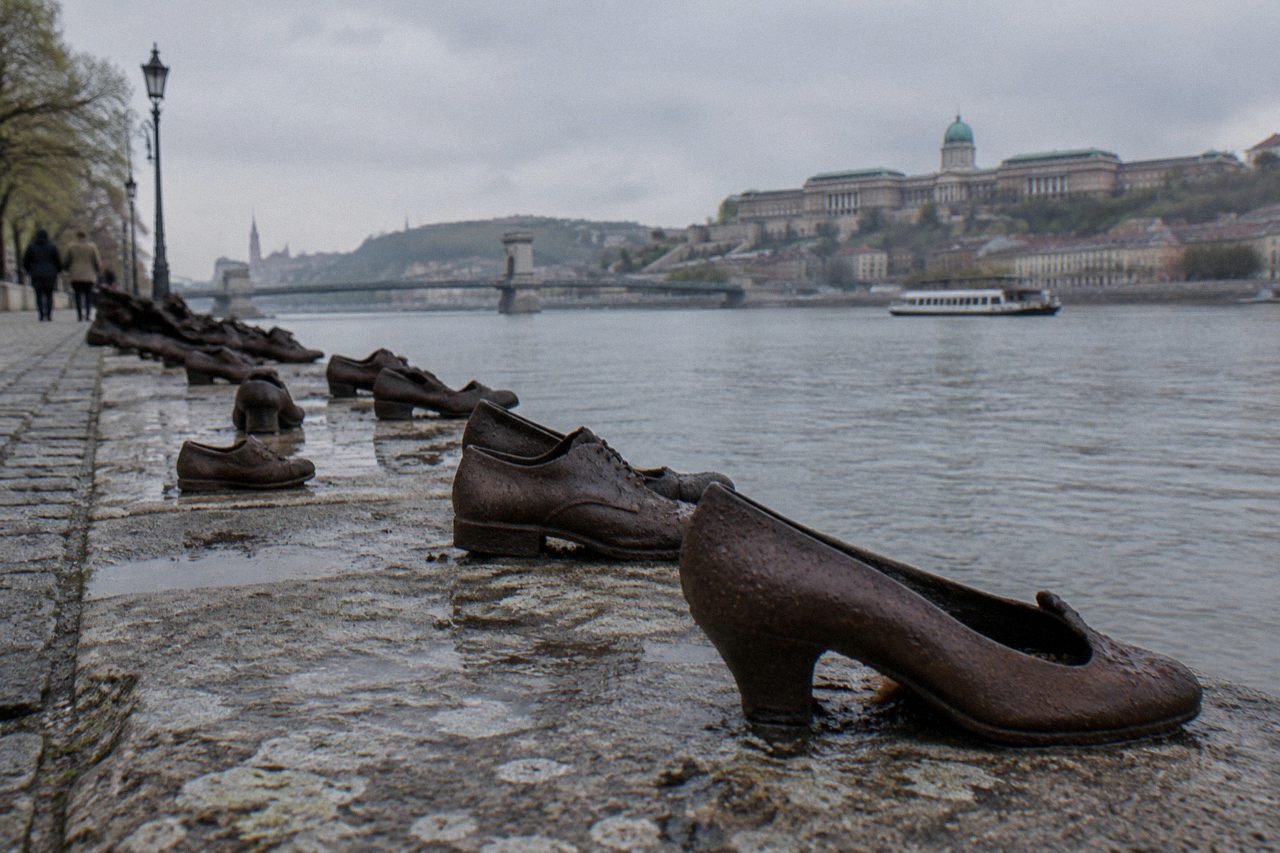 iron shoes set in a row along the stone edge of the Danube embankment in Budapest